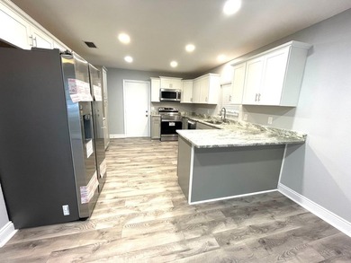 This fully renovated 2-bedroom, 2-bath ground-level home in - photo 8
