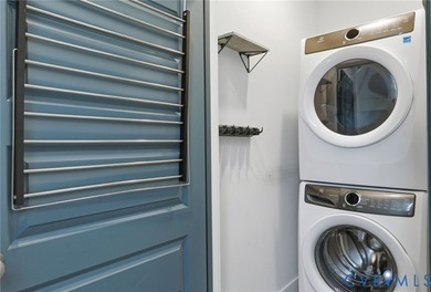 This beautifully designed two-story townhome style condo with a - photo 26