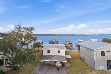 Experience the best of coastal living with this prime waterfront - photo 25