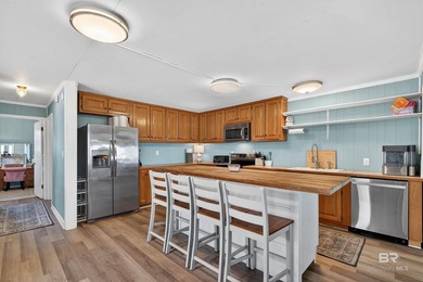 Experience the best of coastal living with this prime waterfront - photo 31