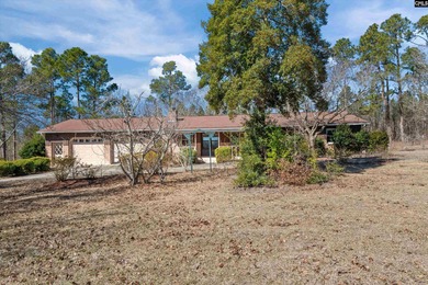 Enjoy peaceful country living on 2.07 private acres at 336 Muddy