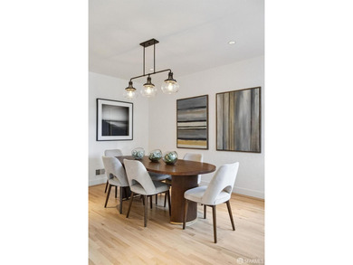 This gorgeous, light-filled home with wood floors throughout - photo 20