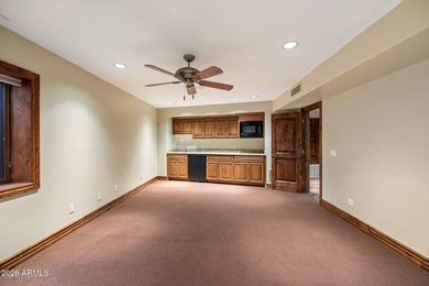 Set within the gated waterfront community of Lake Serena Estates