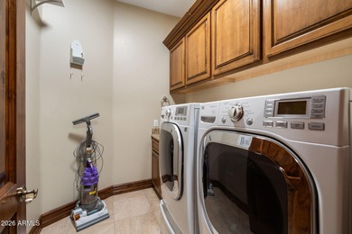 Set within the gated waterfront community of Lake Serena Estates