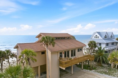 Located within a highly desirable gated coastal community, this