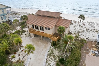 Located within a highly desirable gated coastal community, this