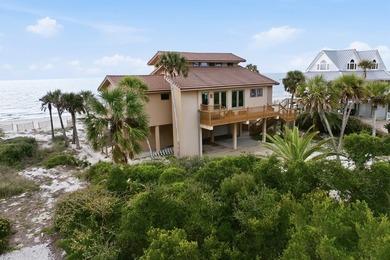 Located within a highly desirable gated coastal community, this