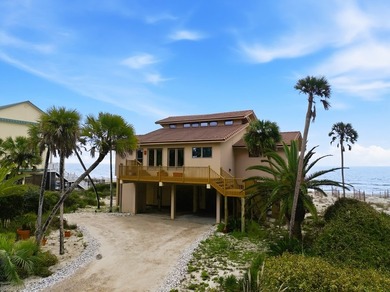 Located within a highly desirable gated coastal community, this