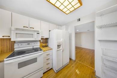 Brand-new floor-to-ceiling impact windows enhance this bright - photo 14