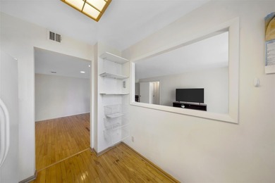 Brand-new floor-to-ceiling impact windows enhance this bright - photo 15