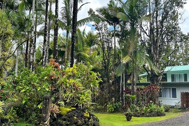 Nestled among towering palms & vibrant tropical foliage, this - photo 4