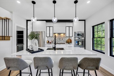 Stunning New Waterfront Construction with Sweeping Water Views - photo 17