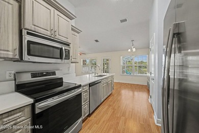 Welcome to this beautifully updated waterfront pool home located - photo 14
