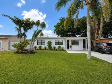 Welcome to this beautifully remodeled home in West Palm Beach ! - photo 1
