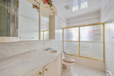 Discover this beautifully renovated legal two-family home in the - photo 14