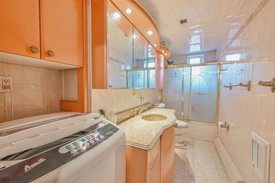 Discover this beautifully renovated legal two-family home in the - photo 17