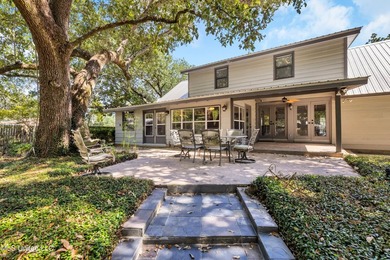 Set on 2.36 acres shaded by beautiful oak trees, this Gulfport - photo 4