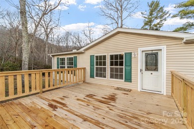 Tucked away on a beautiful 1.06-acre lot, this home invites you