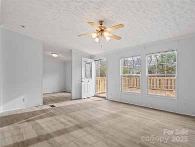 Tucked away on a beautiful 1.06-acre lot, this home invites you