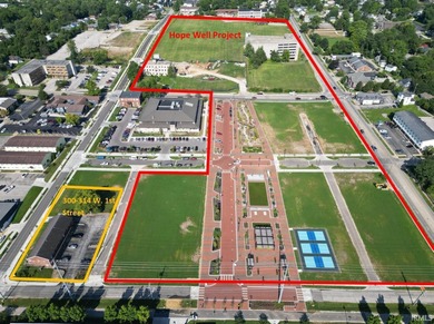 This +-6,120 square foot, two-story property spans three parcels