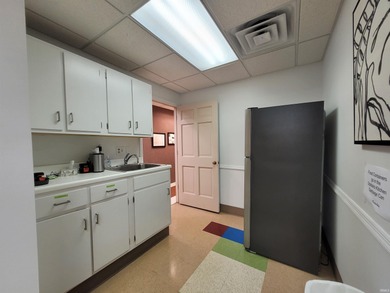 This +-6,120 square foot, two-story property spans three parcels