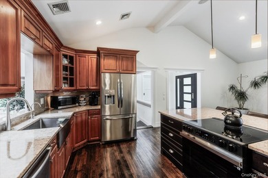 Tucked away on a lush, private three-quarter acre in the highly - photo 13