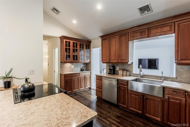 Tucked away on a lush, private three-quarter acre in the highly - photo 14