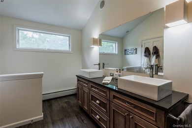 Tucked away on a lush, private three-quarter acre in the highly - photo 28
