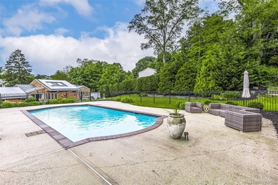 Tucked away on a lush, private three-quarter acre in the highly - photo 39