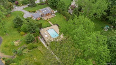 Tucked away on a lush, private three-quarter acre in the highly - photo 42