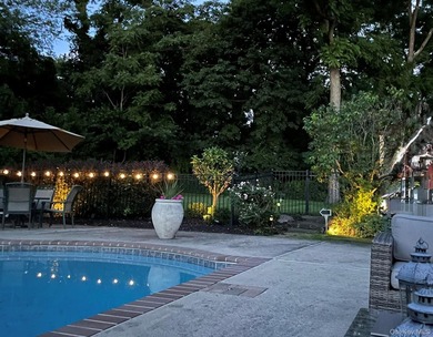Tucked away on a lush, private three-quarter acre in the highly - photo 44