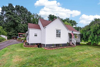 Welcome Home! This charming 1.5-story bungalow is situated on a - photo 2