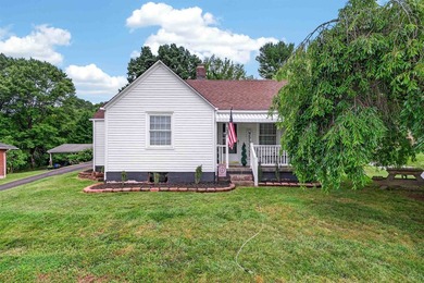 Welcome Home! This charming 1.5-story bungalow is situated on a - photo 3