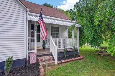 Welcome Home! This charming 1.5-story bungalow is situated on a - photo 4