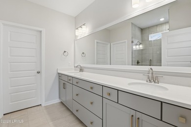 The single-story Bates II plan features three bedrooms and two - photo 15