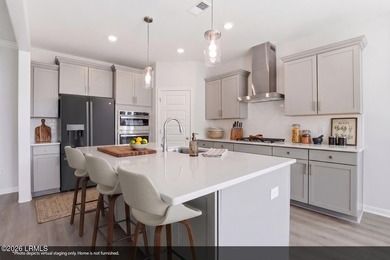 The single-story Bates II plan features three bedrooms and two - photo 22