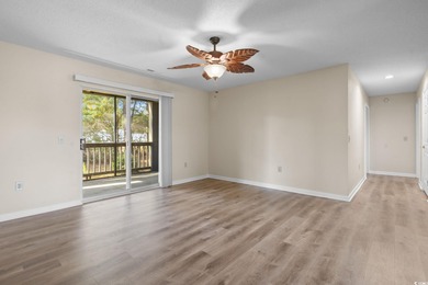 This freshly updated first-floor corner condo offers a bright