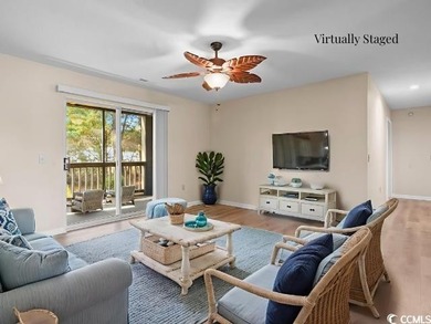 This freshly updated first-floor corner condo offers a bright