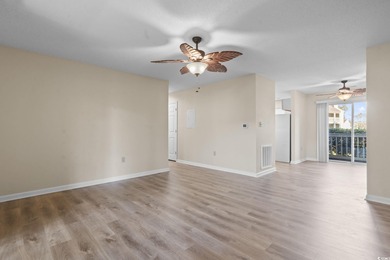 This freshly updated first-floor corner condo offers a bright