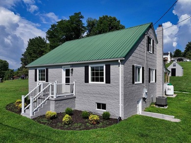 Filled w/ character & charm, this beautifully updated - photo 1