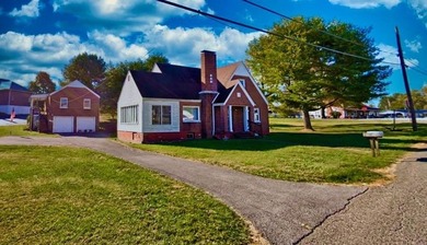 Don't let the front view fool you-this property offers much more - photo 2