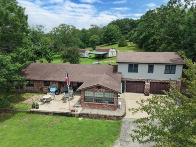 Discover the charm of Ozark living in this unique berm home just - photo 3