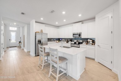 The open-concept floor plan is perfect for entertaining and - photo 6