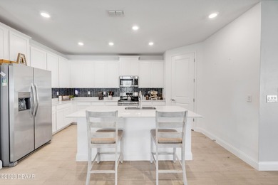 The open-concept floor plan is perfect for entertaining and - photo 7