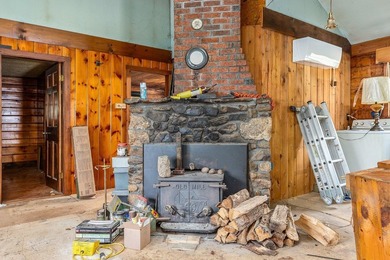 Quaint log cabin with attached incomplete 30 x 40 multi story - photo 12