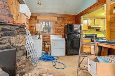 Quaint log cabin with attached incomplete 30 x 40 multi story - photo 16