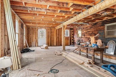 Quaint log cabin with attached incomplete 30 x 40 multi story - photo 21