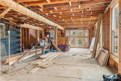 Quaint log cabin with attached incomplete 30 x 40 multi story - photo 22