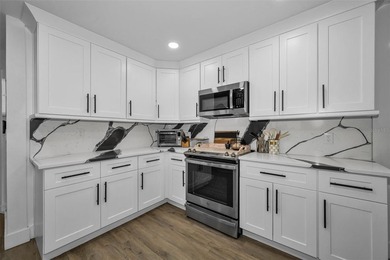 Completely renovated and move-in ready! Situated on two spacious - photo 5