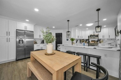 Completely renovated and move-in ready! Situated on two spacious - photo 9